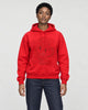Model wearing the red dragon embroidered hoodie with dark jeans, front view