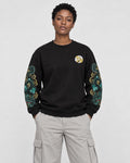 Model wearing the black twin dragon sleeve sweatshirt with stone trousers, front view