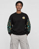 Model wearing the black twin dragon sleeve sweatshirt with stone trousers, front view
