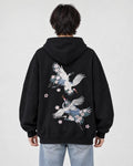 Model wearing the black crane embroidered hoodie with light-wash jeans, back view