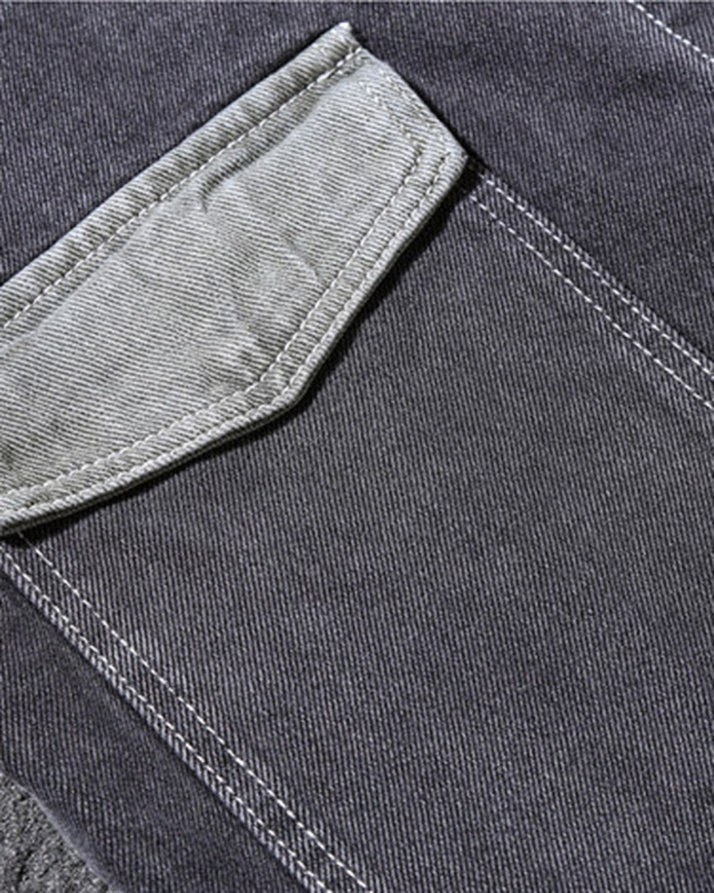 Close-up of the lighter-wash side pocket on the dark gray denim