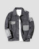 Dark gray patchwork denim jacket with light gray pockets and sleeve panels, front view