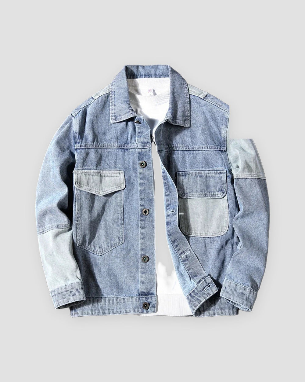 Light blue patchwork denim jacket with pale blue pockets and panels, front view