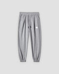 Gray waffle knit joggers with a white drawcord and ribbed ankle cuffs, front view