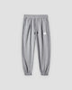 Gray waffle knit joggers with a white drawcord and ribbed ankle cuffs, front view