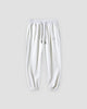 White waffle knit joggers with a white drawcord and ribbed ankle cuffs, front view