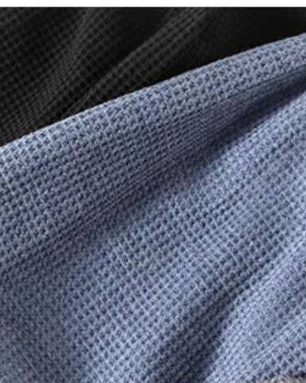 Close-up of the fine waffle-grid knit texture