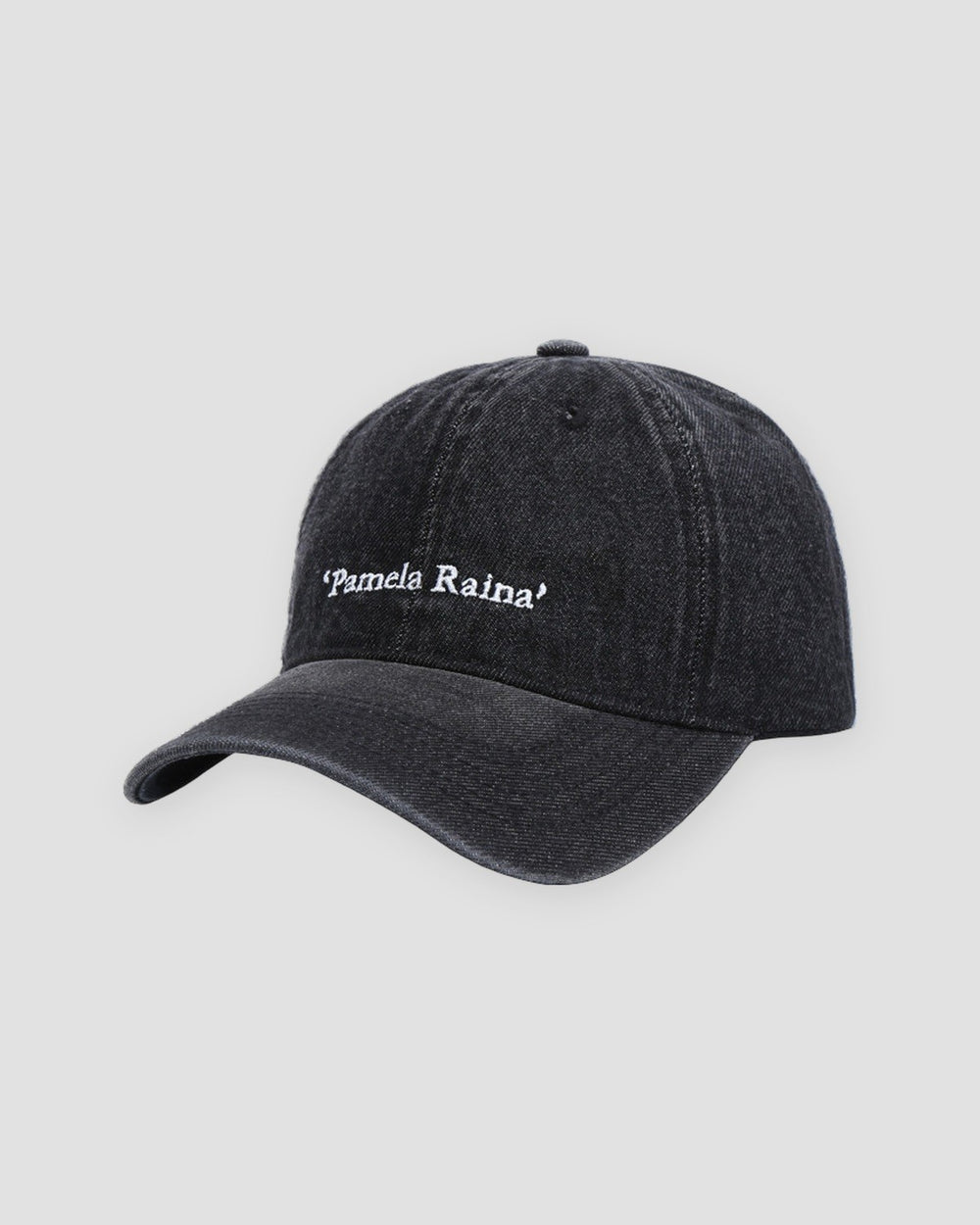 Black washed denim baseball cap with white Pamela Raina lettering on the front