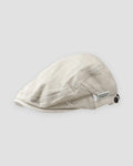Cream washed flat cap with a short peak, cross stitches and a white woven tab