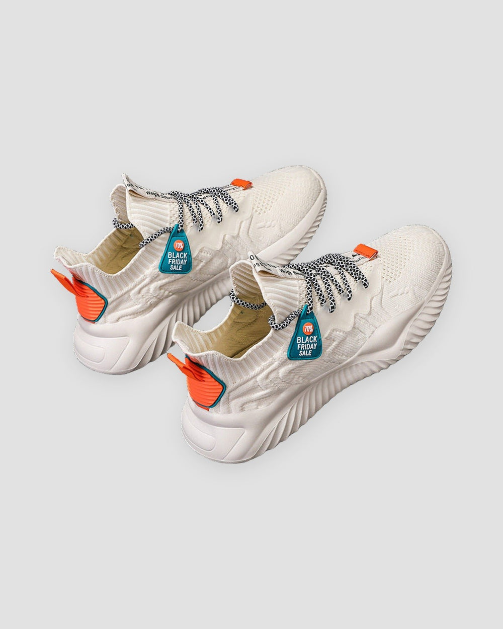 Beige knit sock sneakers with orange heel accents and teal lace tags
