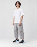Model wearing the black and blue knit sock sneakers, three-quarter view