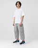 Model wearing the black and blue knit sock sneakers, three-quarter view