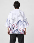 Man seen from behind in the white haori with gray ink mountains, white cranes and red plum blossoms, over a black tee