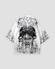 White haori jacket, back view with a black line-art horned mask framed by peonies and leaves