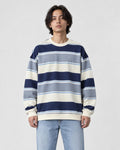 Model wearing the blue-gray striped crewneck sweatshirt with light-wash jeans, front view