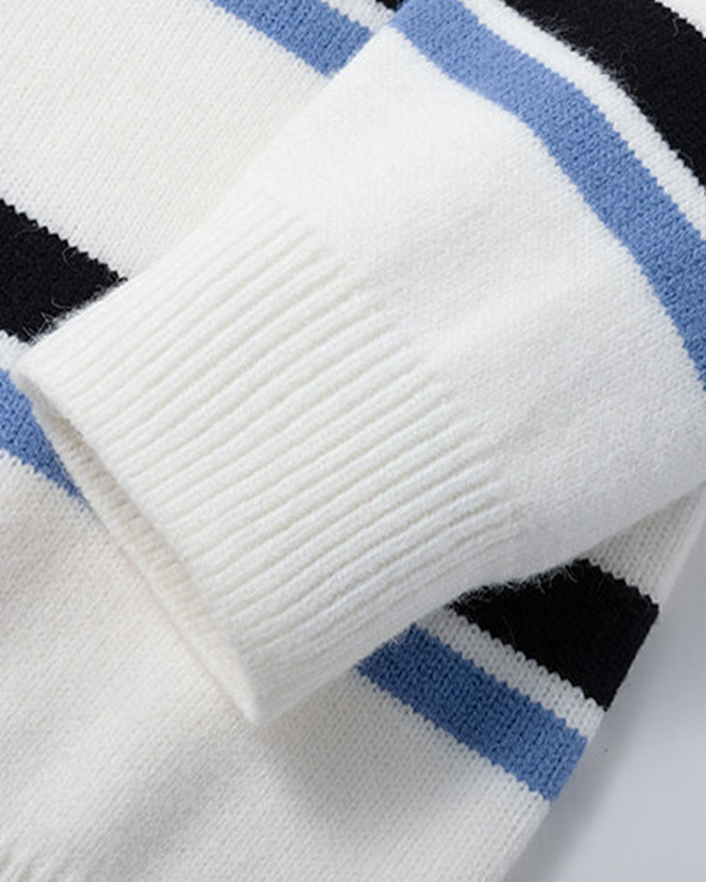 Close-up of the ribbed cuff on the striped sleeve