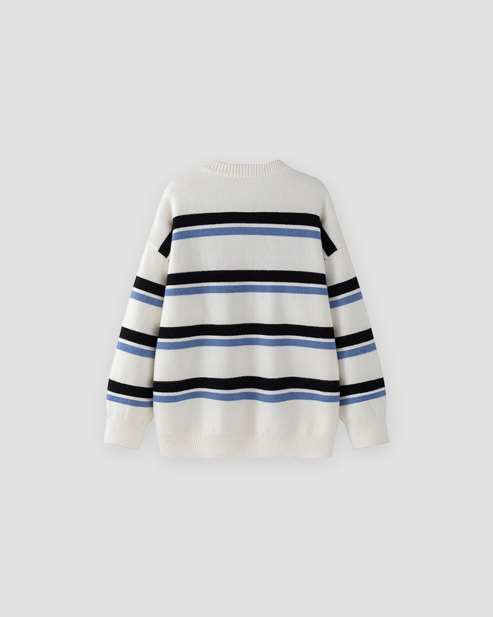 White knit sweater with wide black and light-blue stripes, front view