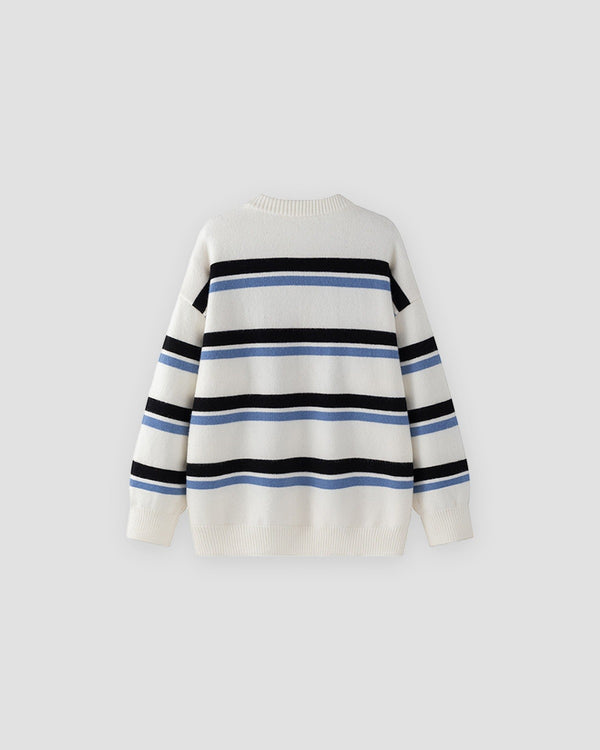 White knit sweater with wide black and light-blue stripes, front view