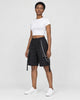 Woman in the black chain cargo shorts turned slightly, showing the pocket, chain and hanging strap
