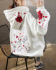 White loose hoodie, back view with embroidered cranes and roses on the hood