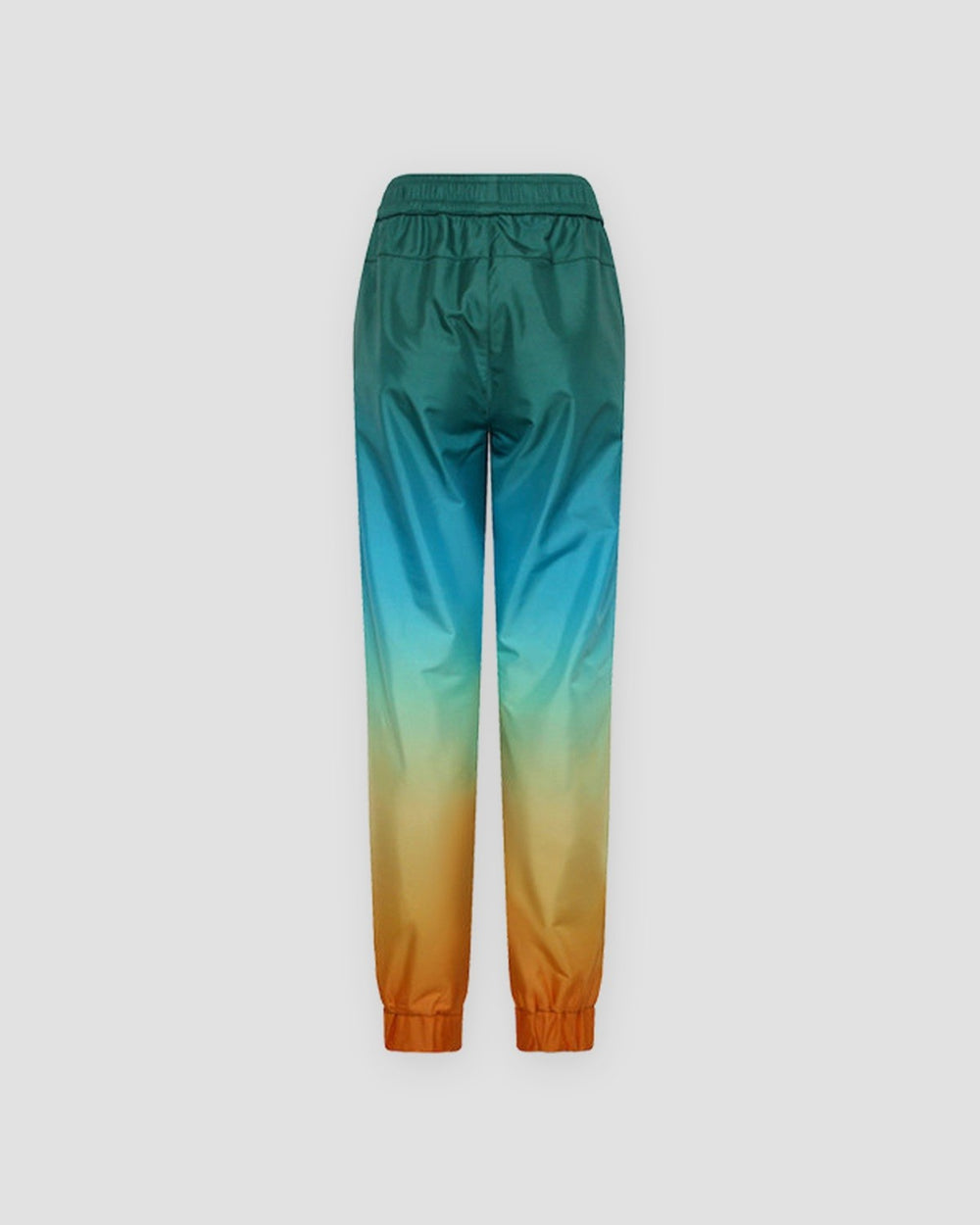 Back of the gradient jogger pants laid flat, with an elastic waistband and orange gathered cuffs