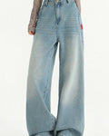 Washed high-waisted wide-leg jeans in light blue, front view of the fade from waist to hem