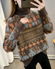 Coffee brown jacquard knit sweater with orange and blue bunny and smiley faces and a lettering band
