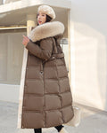 Coffee brown long puffer coat with a khaki fluffy hood trim, a belt and a cream inside facing at the front edge