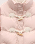 Close view of the two horn toggles on twisted cord loops and the chevron quilting on the pink jacket