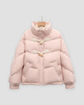Pink short puffer jacket with chevron quilting, a stand collar and two horn toggles on cord loops, on a hanger