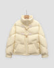 Pale yellow short puffer jacket with chevron quilting and two horn toggles on cord loops, on a hanger