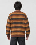 Model wearing the zigzag stripe knit polo sweater, back view