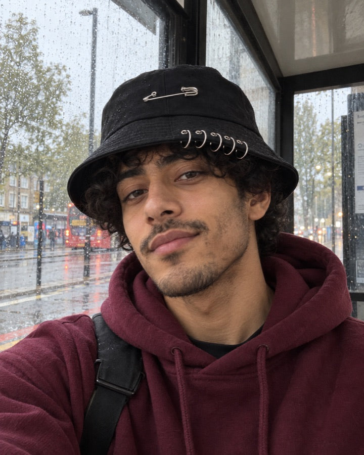 Safety Pin Ring Bucket Hat styled for an everyday setting.